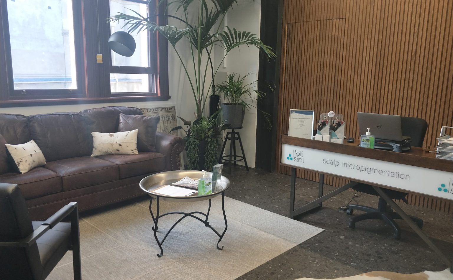 The reception and treatment area of a health department-certified Foli Sim SMP studio