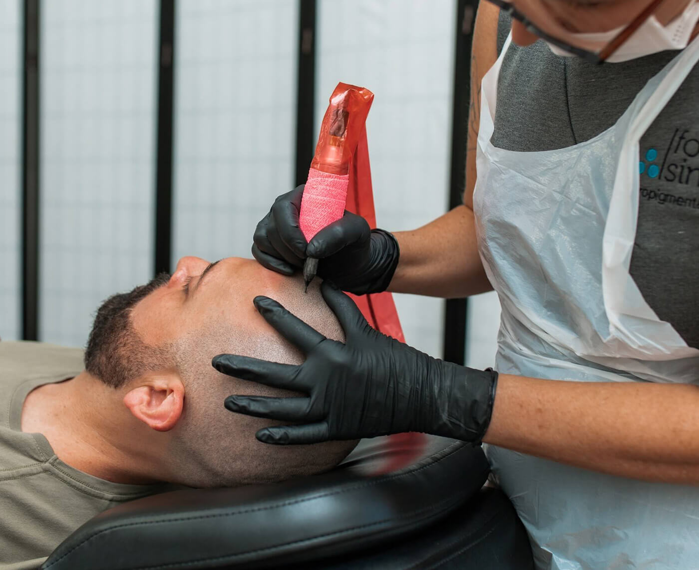 Kate Dawes applying scalp micropigmentation