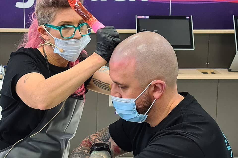 A Foli Sim artist applying scalp micropigmentation in the Perth studio